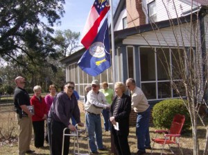 Raising the flags in honor of Lee Hamilton's 94th birthday
