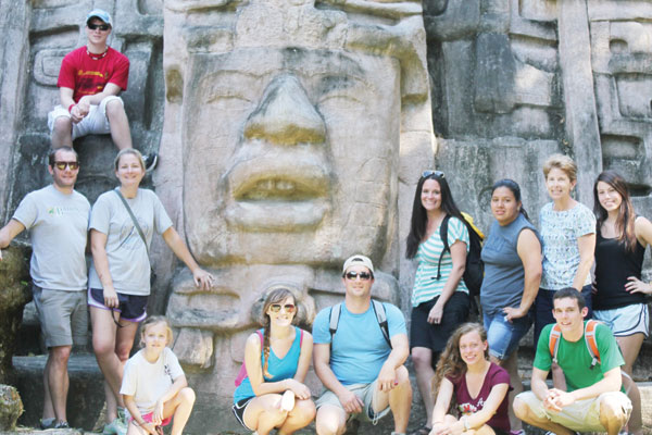 The Bainbridge State College students pose in front of mask at Lamanai temple, in Belize. Shown are: starting at top, left to right, Zack Brinkley of Cairo; Ridge Harper, Jenny Harper and Shelby Harper, of Bainbridge; Suzanne DeValle of Cairo; Mack Lane of Brinson; Amy Warren of Tifton; Ansley Watts, Jessica Vazquez and Valley Rogers, of Bainbridge; Davey Reynolds of Brinson; and Bailey Wells of Colquitt.