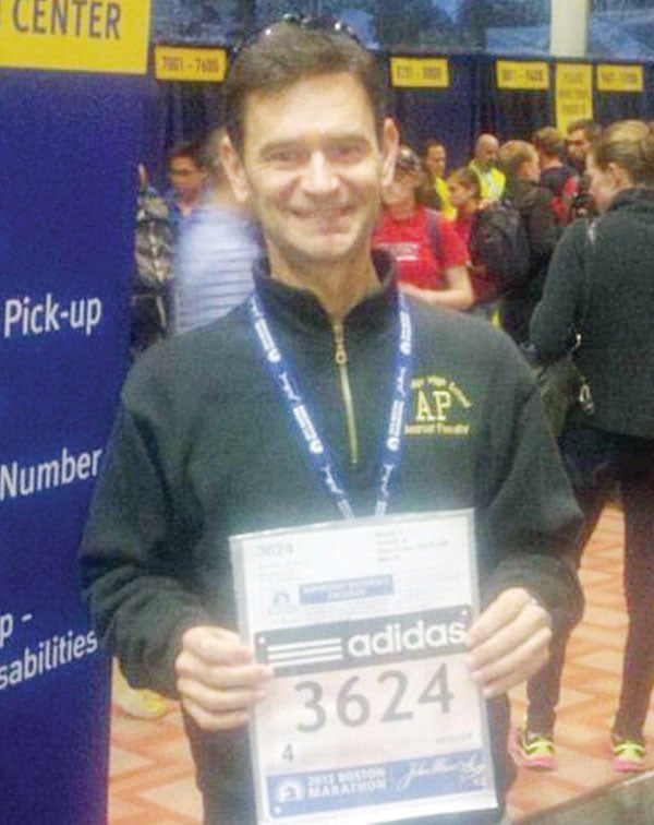Pauncho Hufstetler shows off his number prior to the start of Monday’s Boston Marathon race.|Submitted