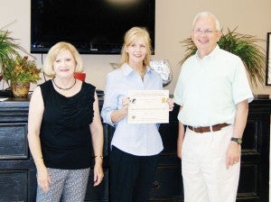 The Bainbridge-Decatur County Humane Society recently received a $7,500 grant to aid with its spay and neuter program. From left to right are Humane Society volunteer Marjean Boyd, Bainbridge Animal Shelter director Beth Eck and Georgia Commissioner of Agriculture Gary W. Black.