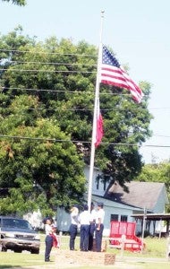 Bainbridge High School JROTC cadets raise the American flag above Parker Park in Climax, GA