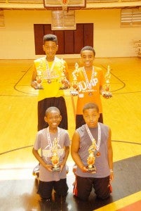 CAMP AWARD WINNERS are back row, Milton Gayle and Jeremiah Davis, both of whom won the “Hot Shot” and free throw competitions in their age group, and in front, Myles Malone (Hot Shot winner) and Terry Thomas (free throw winner).