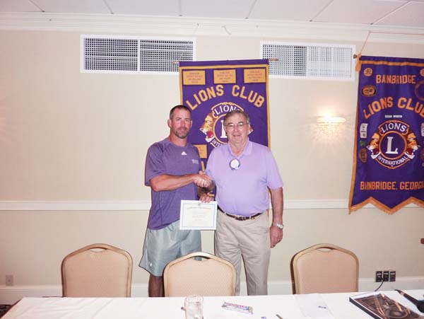 GUEST SPEAKER: Lion President Frank Loeffler thanking Coach Jeff Littleton for speaking to the Lions Club.
