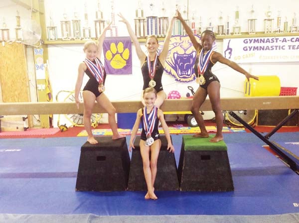 FIRST IN THE NATION: The four gymnasts who earned all-around gold medals were: top, left to right, Emma Foster, Emily Perkins and Carmen Fillingame; and bottom, Emily Grace Tuten.