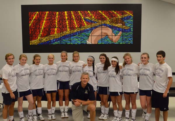 TALENTED TEAM: Grace Christian Academy varsity volleyball team members are, left to right, manager Brent Warr, Lindsey Duke, Kelsey Harrell, Merrianna Parker, Melissa Mills, McKenzie Brown, Kendi Castoro, Shellby Woodrum, Sarah Castoro, Addie Elkins, Kaitlyn Holcombe and manager Jackson Harrell. The varsity is coached by Erwin Harrell, center.
