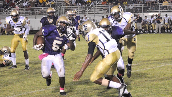 Running back Aaron Calloway jukes by a Yellowjacket defender. Calloway rushed for 61-yards. -- Powell Cobb
