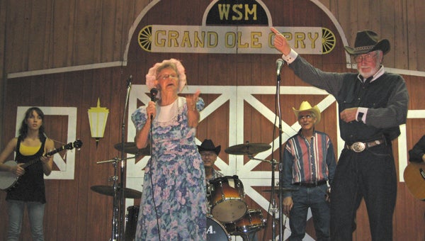 Grand Ole Opry performs on stage during last year’s Swine Time in Climax. The group encourages everyone in the area to come out and dance as they sing and play music.