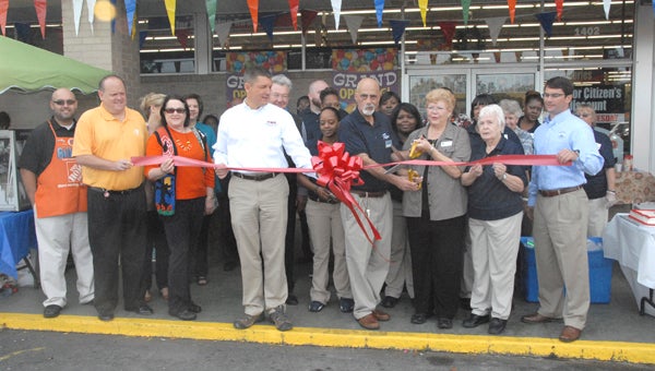 Members of the Decatur County Chamber of Commerce cut the ribbon at Roses on Thursday. -- Powell Cobb