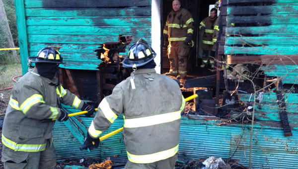 Firefighters with Decatur County and Bainbridge Public Safety tear through walls of a home on Green Street to investigate the cause of a fire early Saturday morning. The fire began in the victim’s bedroom and was contained within 30 minutes of officers arriving. The fire caused one fatality and the cause is still under investigation.
