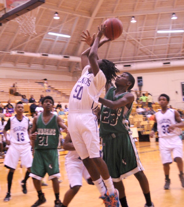 Travis Campbell goes in for a layup — Powell Cobb