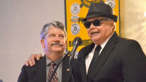 Dr. Robinson, left, is roasted by Rev. Randy Mosley, who dressed in his entrance as a Blues Brother. Mosley was roasted and jabbed at by friends and family for the duration of the night.