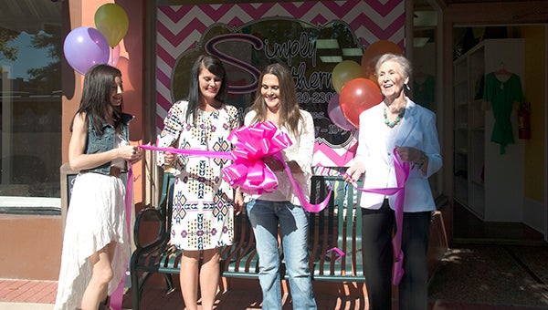 Misty Davis, Crissy Young, Teresa Chason and Suzy Willis cut the ribbon on Simply Southern, a clothing boutique on the square. 