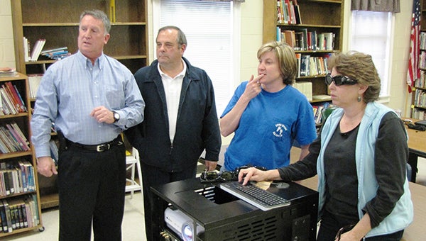 Rotary President, Gerard Kwilecki, second from left, watches a training session at Grace Christian Academy, where teaching staff learn how to use the new 3-D Rover. 