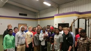 part of the team: Bainbridge Bearcat football players surround Sabian Fuller Sunday when he visited the team before leaving for Chemo treatment in Atlanta.