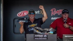Greg Jeter cheers with his co-angler championship trophy. Both men are from Bainbridge.