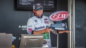 Clint Brown smiles while holding his Pro Championship Trophy from the Lake Seminole event. 