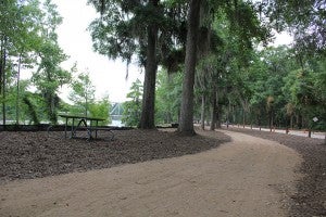 Bainbridge is finishing up its nature trail in between Cheney Griffin Park and the Earle May Boat Basin, Above, the crushed rock trail winds along the Flint next to Hatcher Road