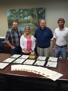 The Post-Searchlight’s ad staff, left-to-right, Jason Smith, Nichole Buchanan, Ralph Dobson and William Hand received more than 20 first and second place awards from the Georgia Press Association last week, including and award for Ad Idea of the Year. The advertisement that won was created by Smith for Tuten Chiropractic Center.
