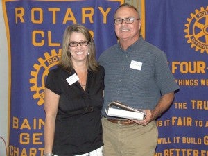 Rick McCaskill, standing with Rotary president Kim Walden, received the President’s Award.