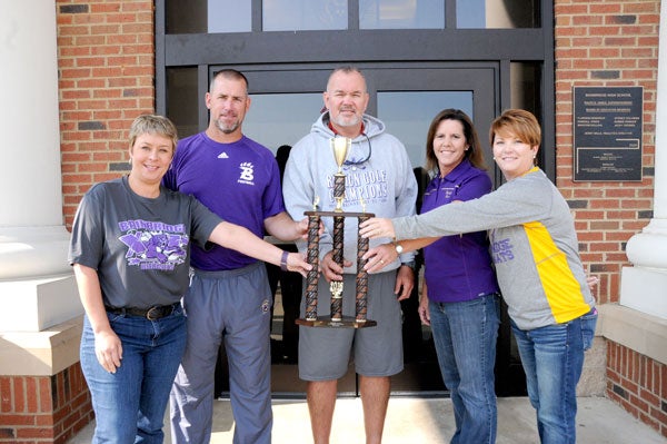 Powell Cobb — Post-Searchlight coaching the best: Cross-country coach Yvette Greene, football coach Jeff Littleton, golf coach Tom Wheeler, swim coach Tracey Poppell and tennis coach Amy Thomas smile with this year’s Region All-Sports Trophy.
